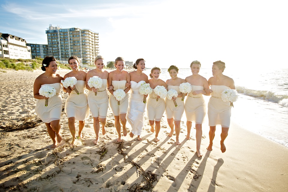 bridesmaids in nude dresses on beach