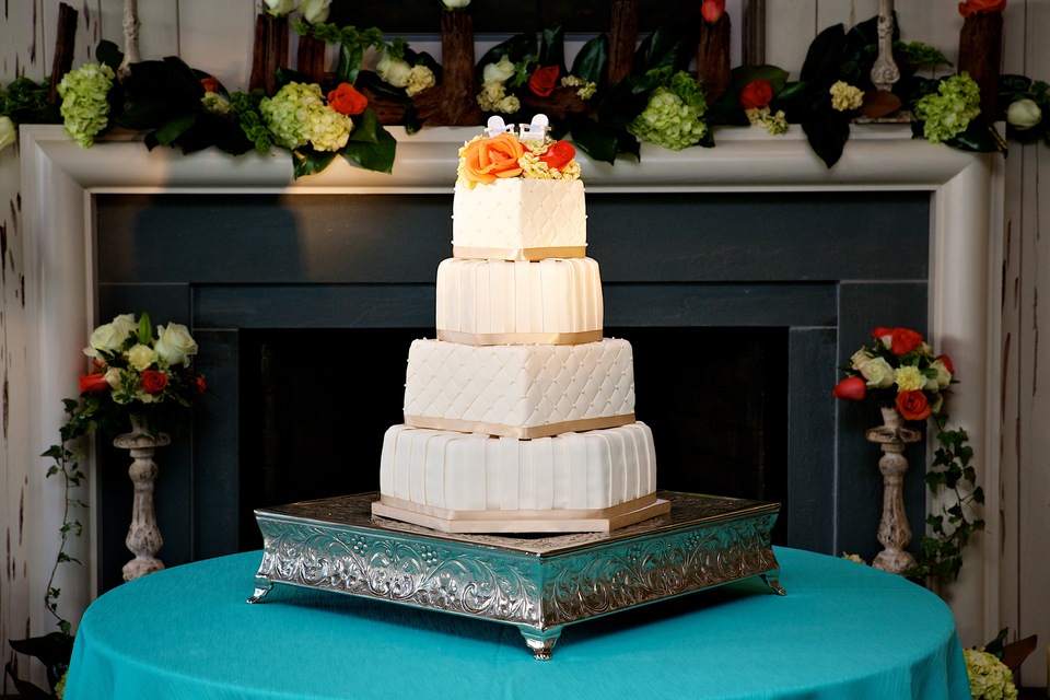 white cake in front of fireplace