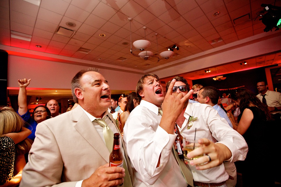 groom and father dancing at wedding